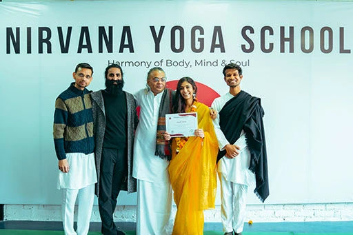 Ayushi Doshi, student of Nirvana Yoga School Rishikesh with her 500 hour Yoga Teacher Training certificate certification	